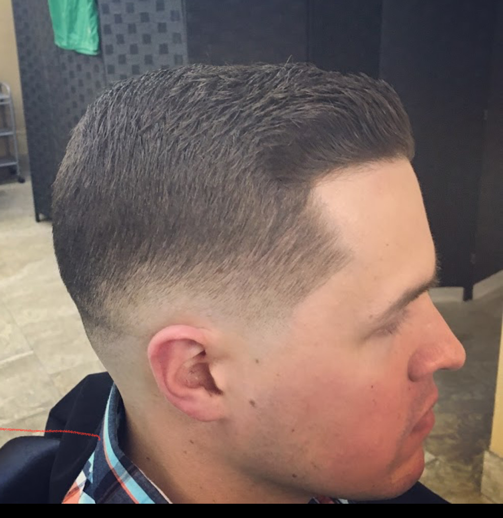 Skin fade with clean side part