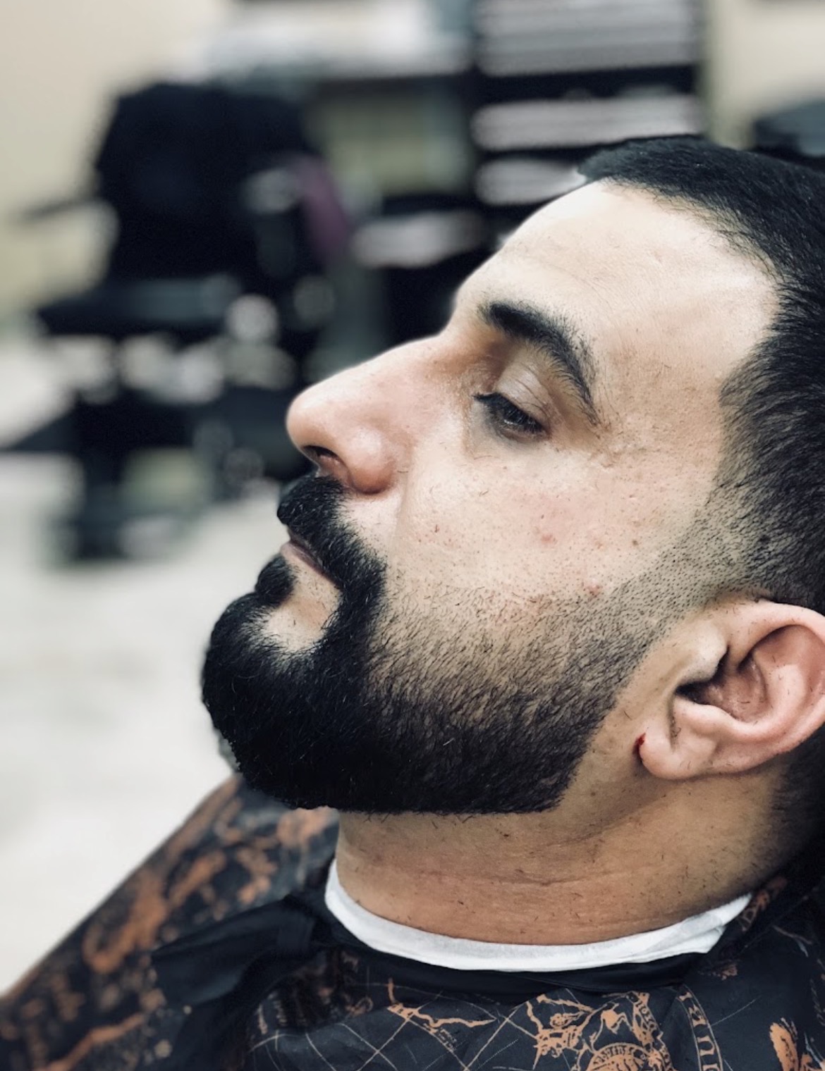Full beard shape-up with taper fade